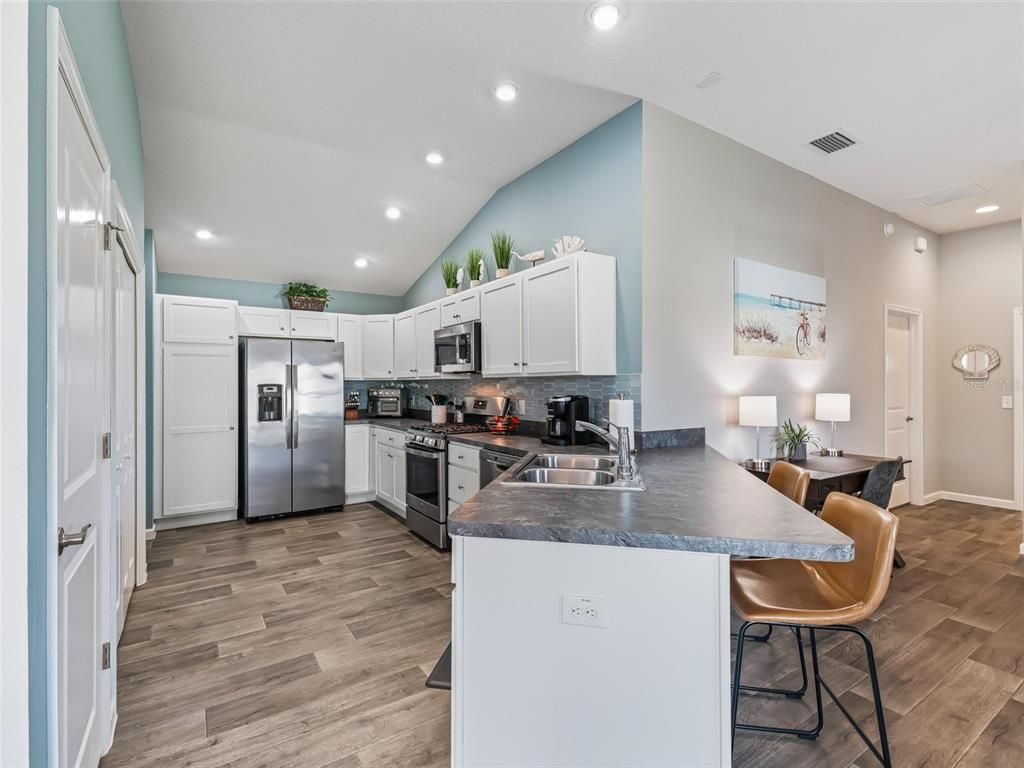 Interior, Kitchen, Recessed Lighting, Stainless Steel Appliances, Wood Texture Flooring