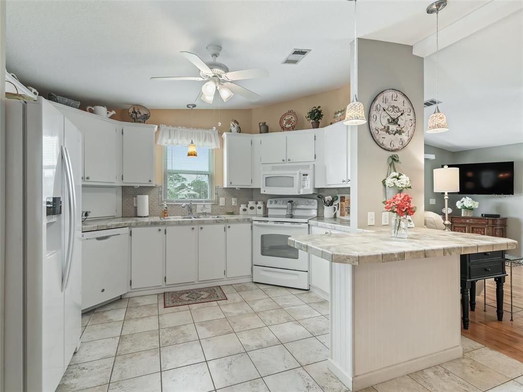 Interior, Kitchen, Pendant Lights, Tile Countertops, Wood Texture Flooring
