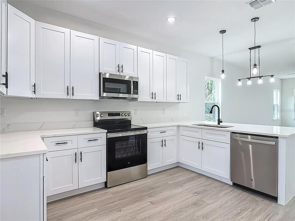 Interior, Kitchen, Pendant Lights, Recessed Lighting, Stainless Steel Appliances, Wood Texture Flooring