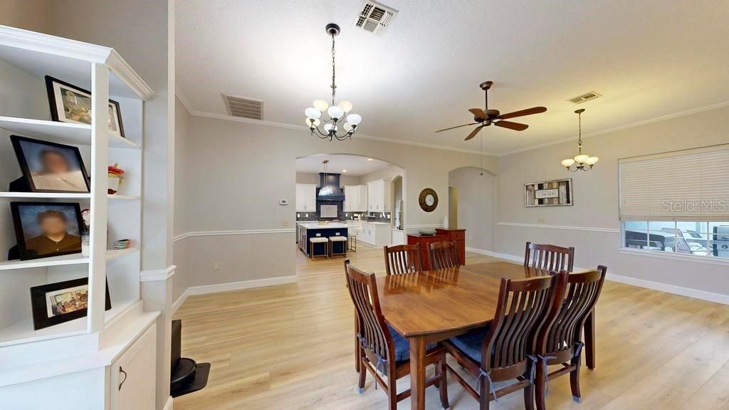 Chandelier, Dining room, Interior, Kitchen, Pendant Lights, Recessed Lighting, Stainless Steel Appliances, Wood Texture Flooring