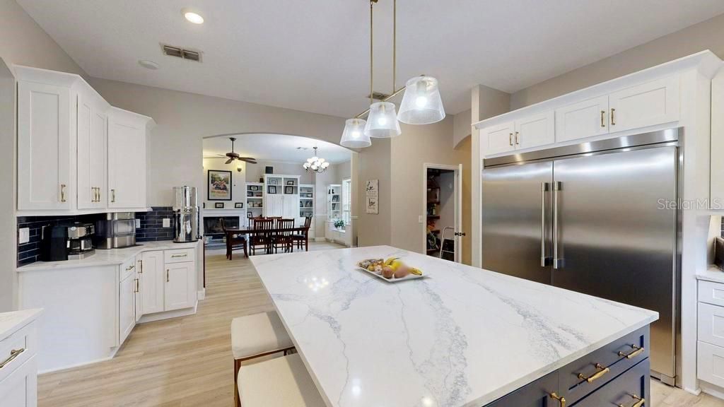 Chandelier, Dining room, Interior, Kitchen, Pendant Lights, Recessed Lighting, Stainless Steel Appliances, Wood Texture Flooring