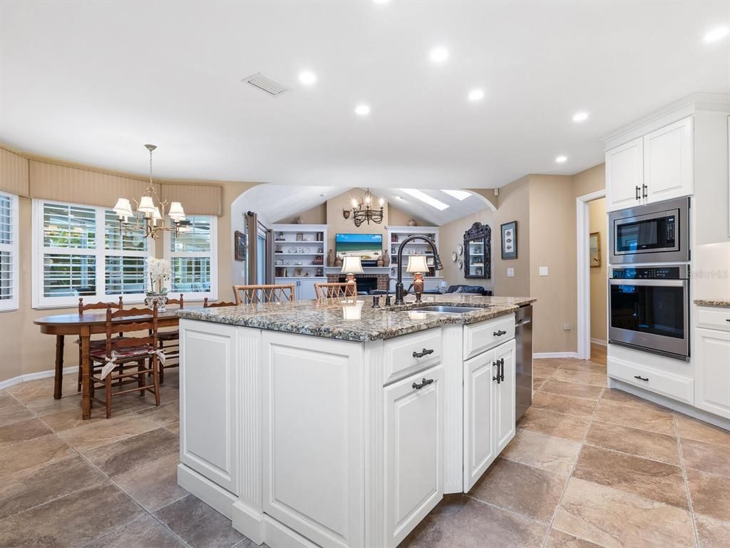 Chandelier, Dining room, Fireplace, Interior, Kitchen, Recessed Lighting, Stainless Steel Appliances