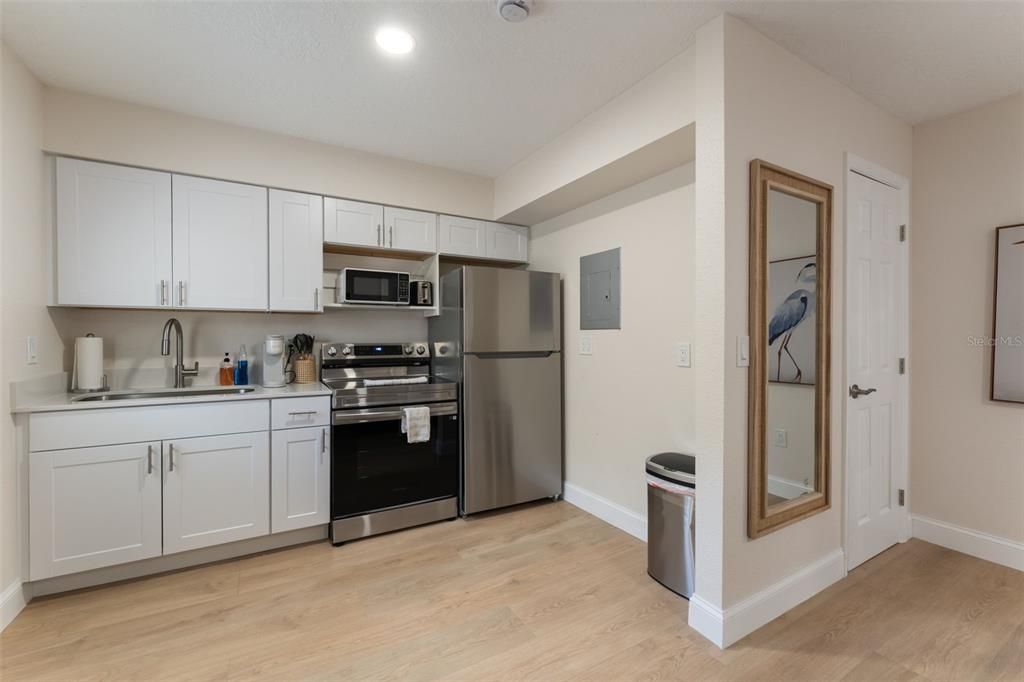 Interior, Kitchen, Recessed Lighting, Stainless Steel Appliances, Wood Texture Flooring