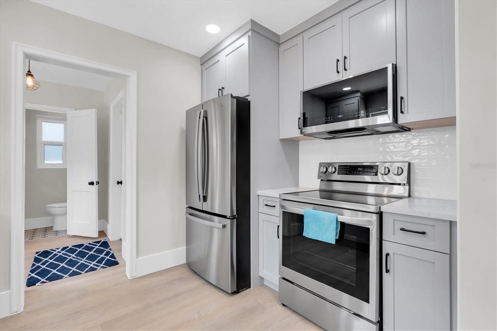 Interior, Kitchen, Recessed Lighting, Stainless Steel Appliances, Wood Texture Flooring