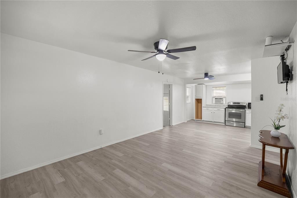 Empty room, Interior, Kitchen, Stainless Steel Appliances, Wood Texture Flooring