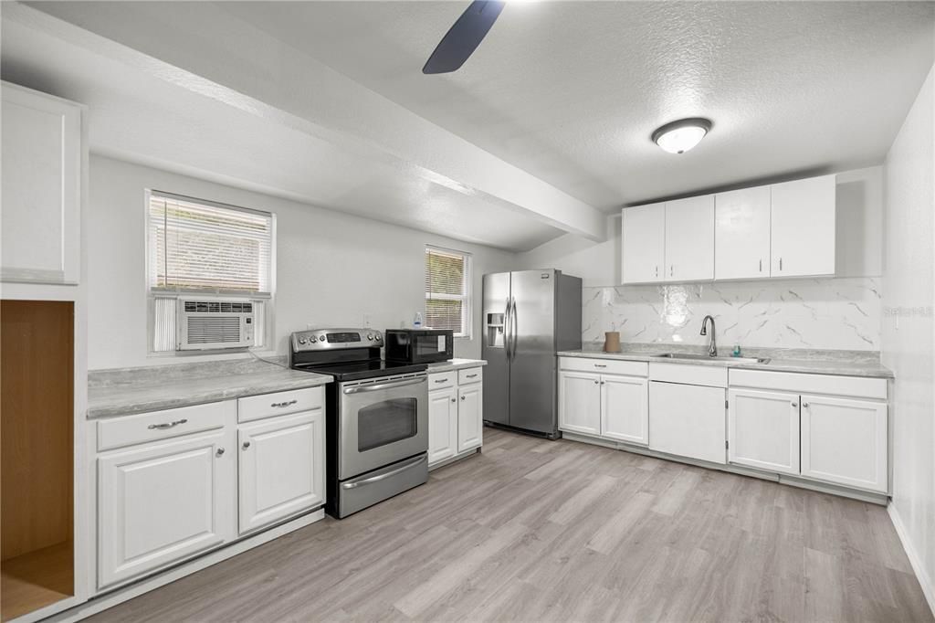 Interior, Kitchen, Marble Walls, Stainless Steel Appliances, Wood Texture Flooring