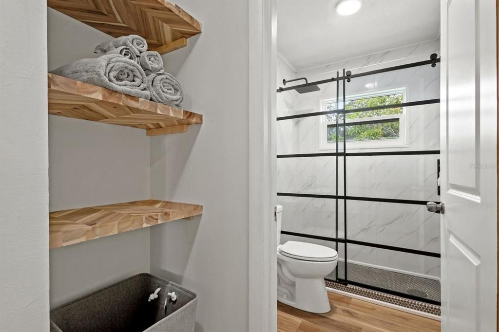 Bathroom, Glass Shower, Interior, Marble Walls, Recessed Lighting, Wood Texture Flooring