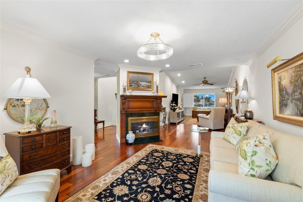 Chandelier, Fireplace, Interior, Living room, Recessed Lighting, Wood Texture Flooring