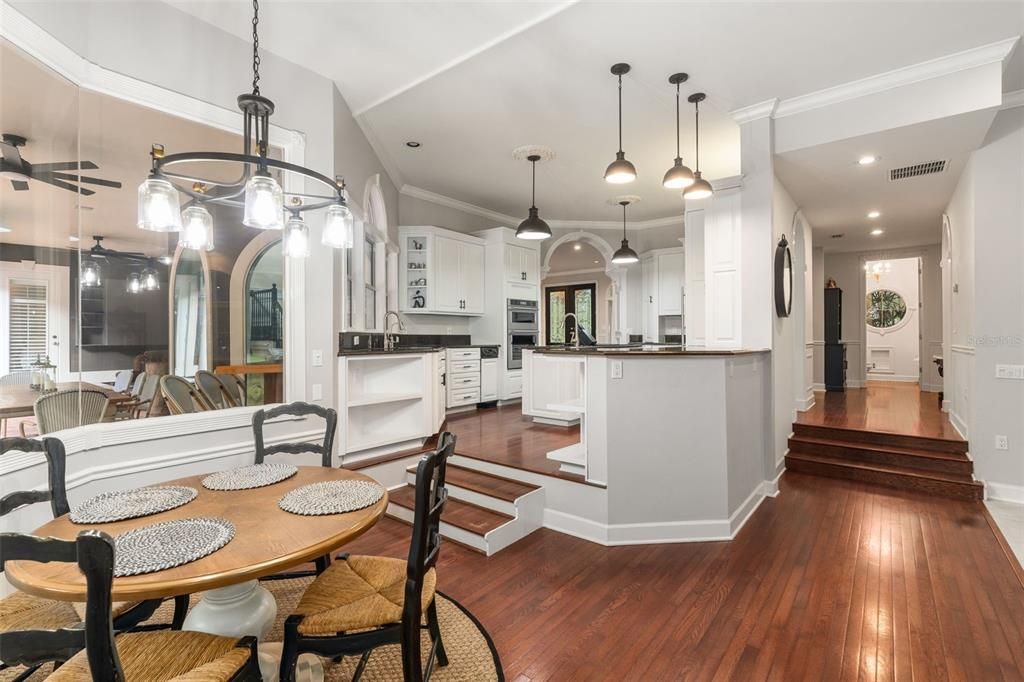 Dining room, Interior, Kitchen, Pendant Lights, Recessed Lighting, Stainless Steel Appliances, Wood Texture Flooring