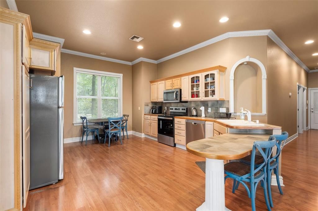 Dining room, Interior, Kitchen, Recessed Lighting, Stainless Steel Appliances, Wood Texture Flooring