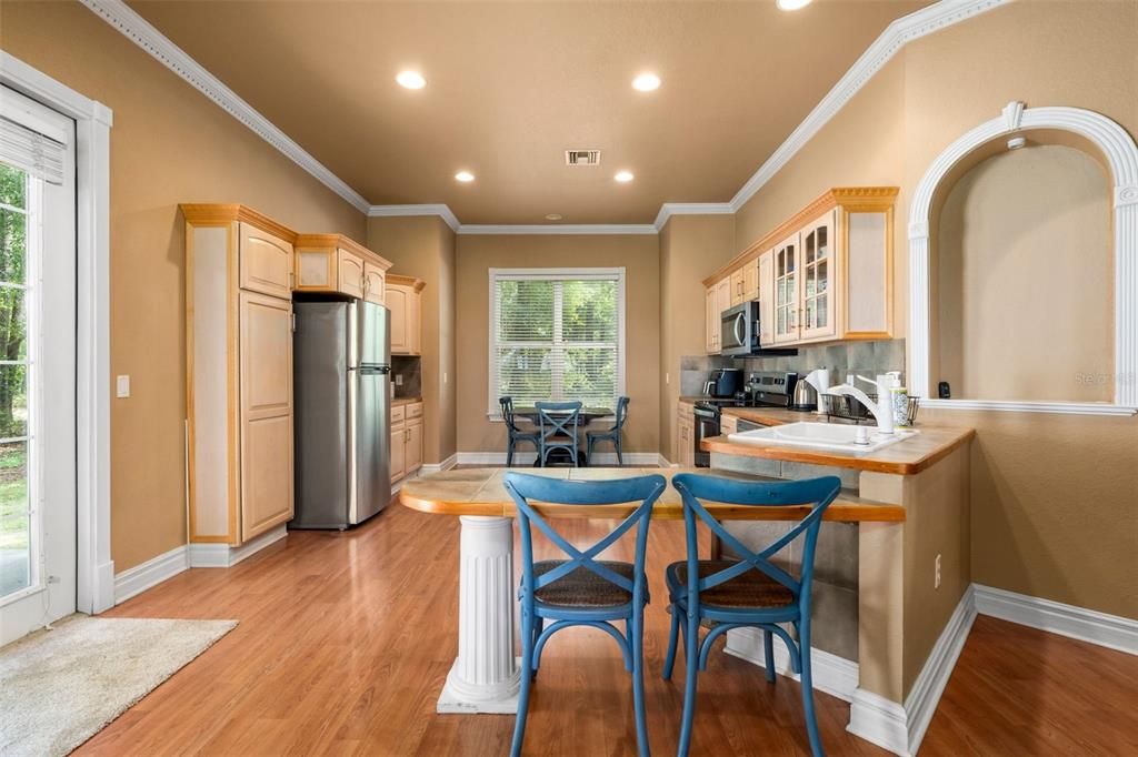 Dining room, Interior, Kitchen, Recessed Lighting, Stainless Steel Appliances, Wood Texture Flooring