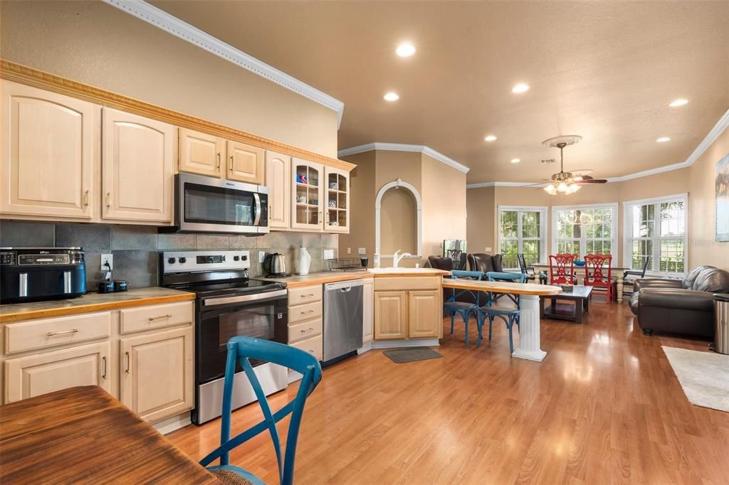 Dining room, Interior, Kitchen, Living room, Recessed Lighting, Stainless Steel Appliances, Wood Texture Flooring