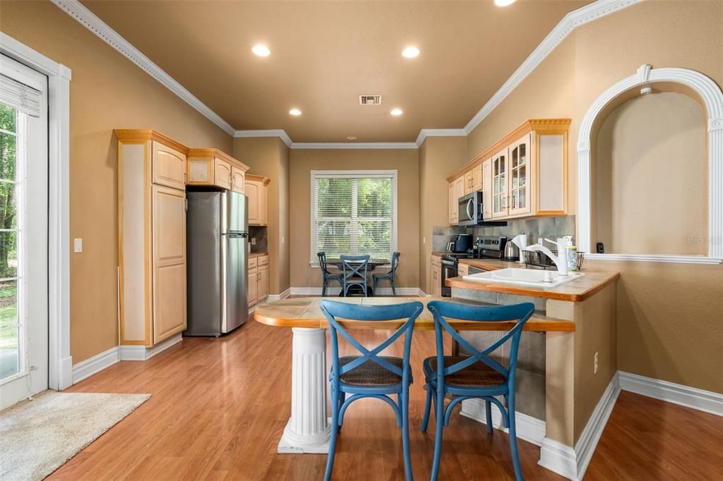 Dining room, Interior, Kitchen, Recessed Lighting, Stainless Steel Appliances, Wood Texture Flooring