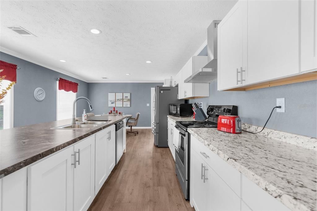 Dining room, Interior, Kitchen, Recessed Lighting, Stainless Steel Appliances, Wood Texture Flooring