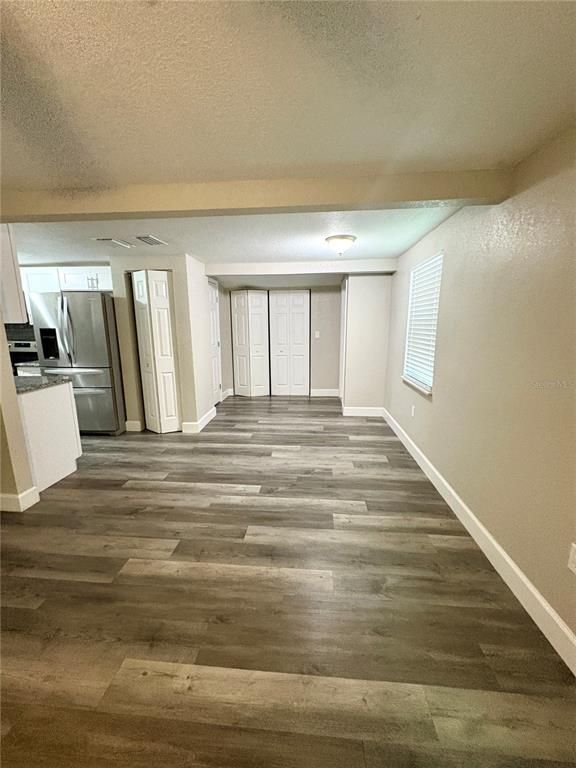 Empty room, Interior, Kitchen, Stainless Steel Appliances, Wood Texture Flooring