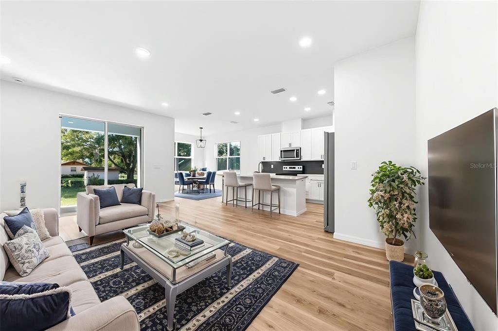 Dining room, Interior, Kitchen, Living room, Pendant Lights, Recessed Lighting, Stainless Steel Appliances, Wood Texture Flooring