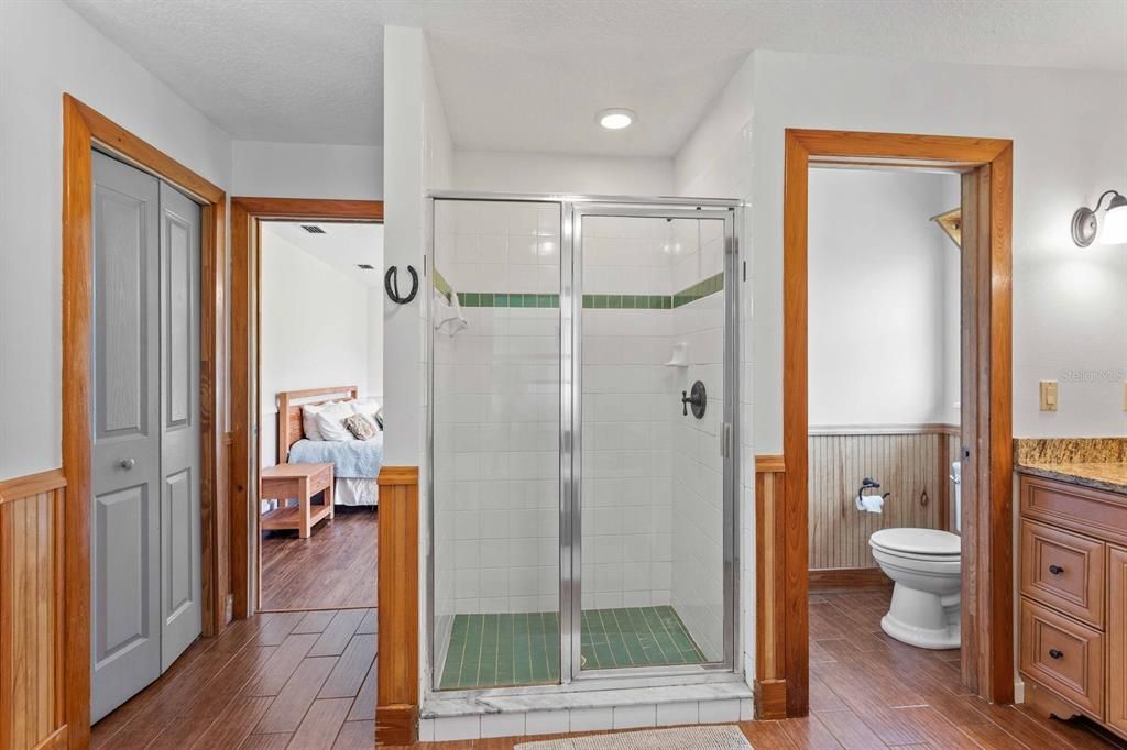 Bathroom, Bedroom, Glass Shower, Interior, Recessed Lighting, Wood Texture Flooring