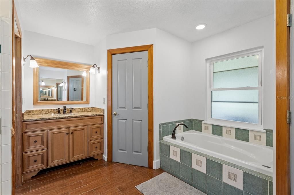 Bathroom, Dual Sink Vanities, Interior, Recessed Lighting, Wood Texture Flooring