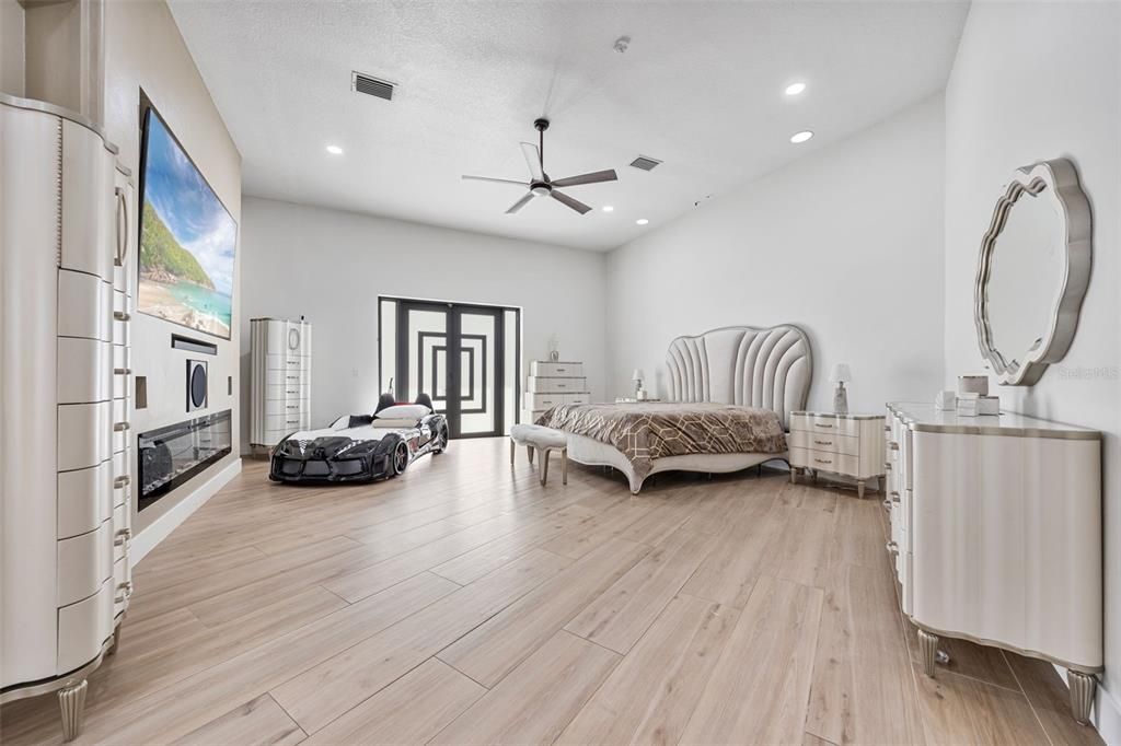 Bedroom, Fireplace, Interior, Recessed Lighting, Wood Texture Flooring