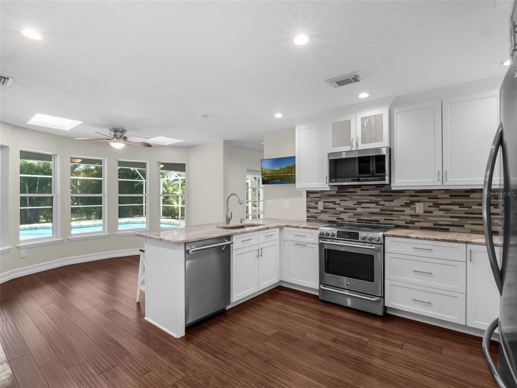 Interior, Kitchen, Recessed Lighting, Stainless Steel Appliances, Wood Texture Flooring