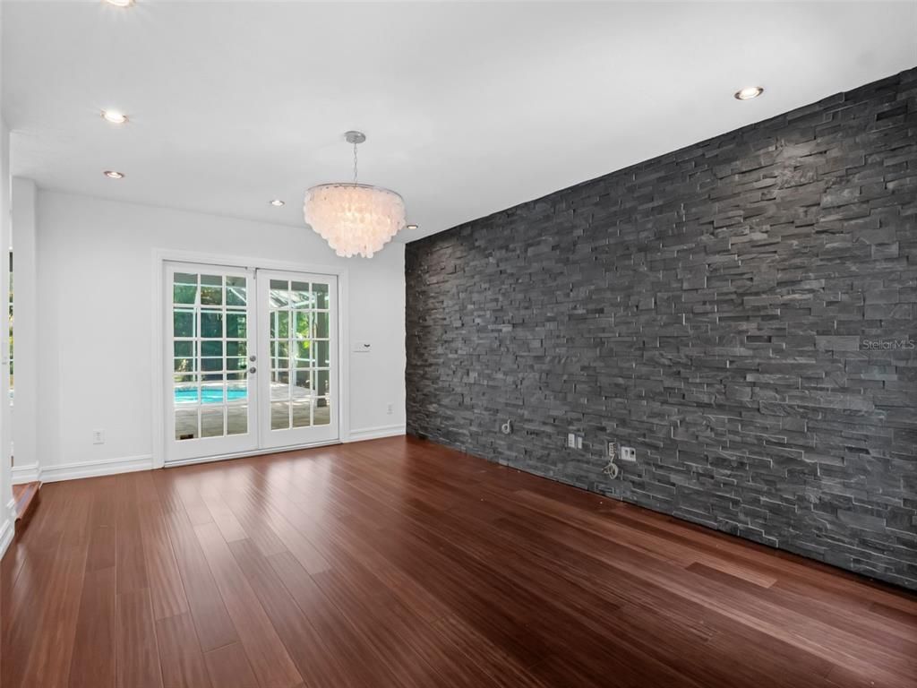 Chandelier, Empty room, Interior, Recessed Lighting, Stone Walls, Wood Texture Flooring