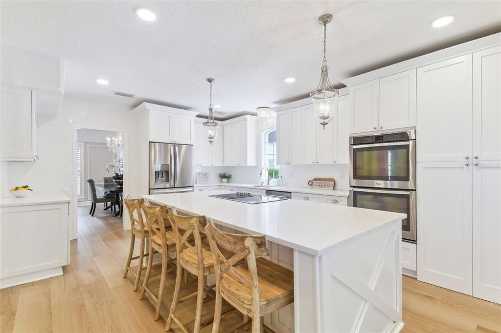 Dining room, Interior, Kitchen, Pendant Lights, Recessed Lighting, Stainless Steel Appliances, Wood Texture Flooring
