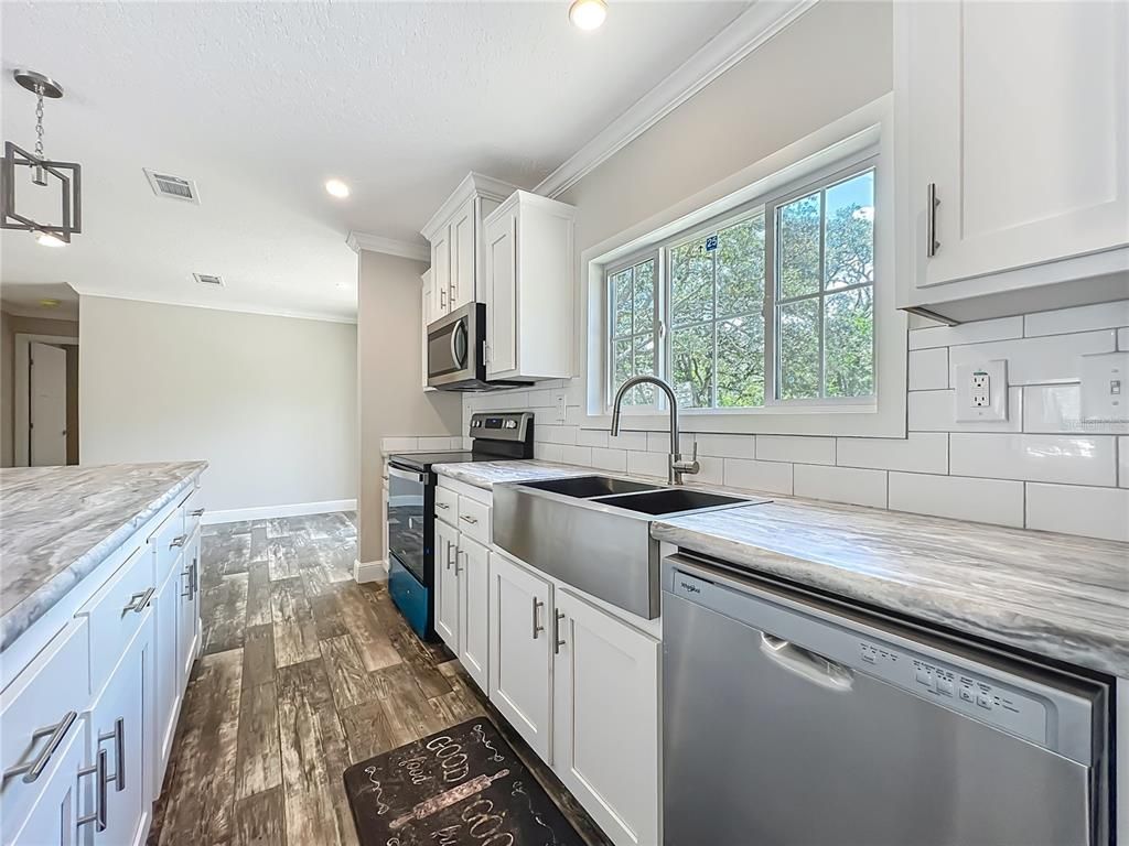 Interior, Kitchen, Pendant Lights, Recessed Lighting, Stainless Steel Appliances, Wood Texture Flooring