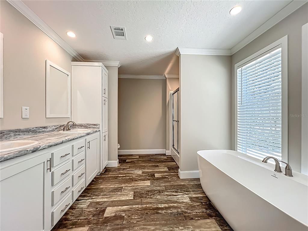 Bathroom, Dual Sink Vanities, Free Standing Baths, Interior, Recessed Lighting, Wood Texture Flooring