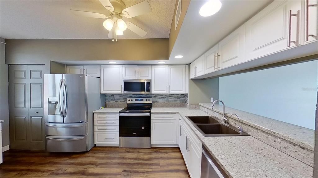 Interior, Kitchen, Recessed Lighting, Stainless Steel Appliances, Wood Texture Flooring