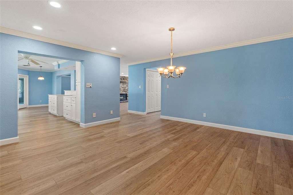Chandelier, Empty room, Fireplace, Interior, Pendant Lights, Recessed Lighting, Wood Texture Flooring