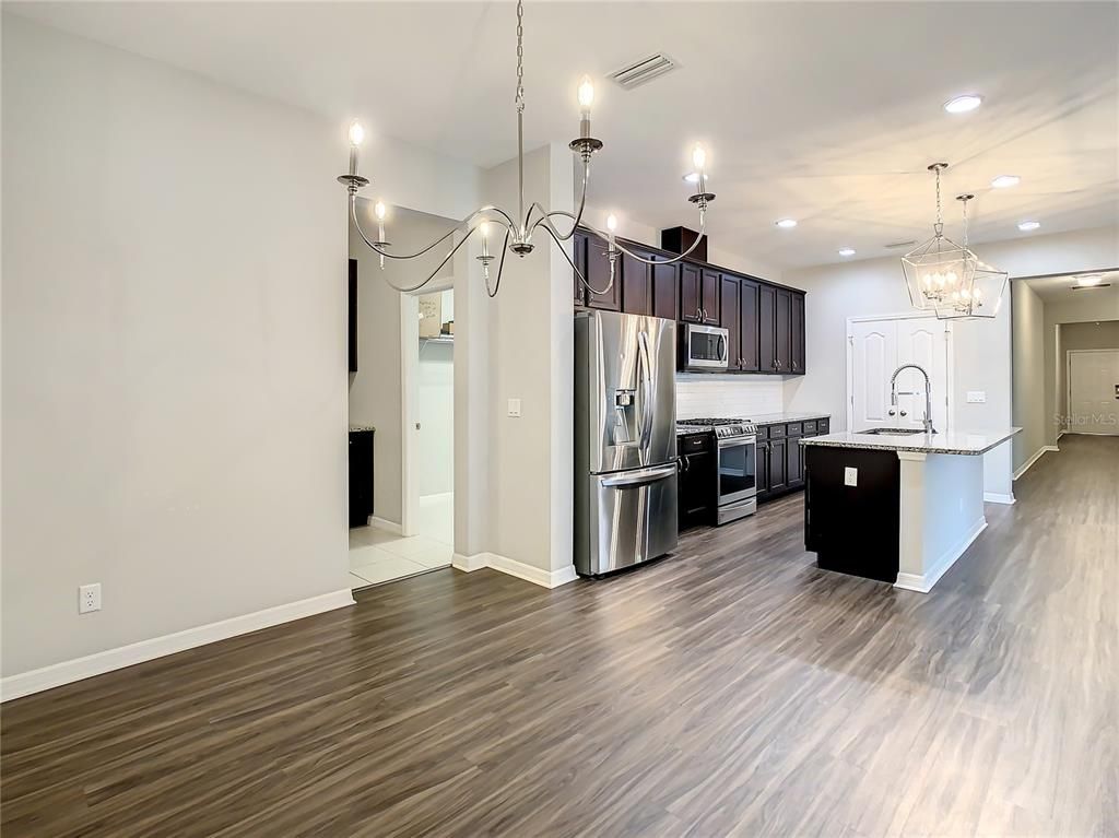 Chandelier, Interior, Kitchen, Pendant Lights, Recessed Lighting, Stainless Steel Appliances, Wood Texture Flooring