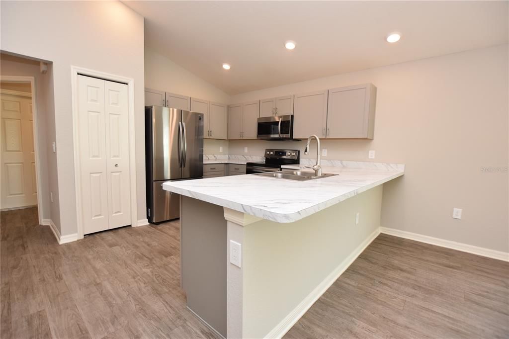 Interior, Kitchen, Recessed Lighting, Stainless Steel Appliances, Wood Texture Flooring