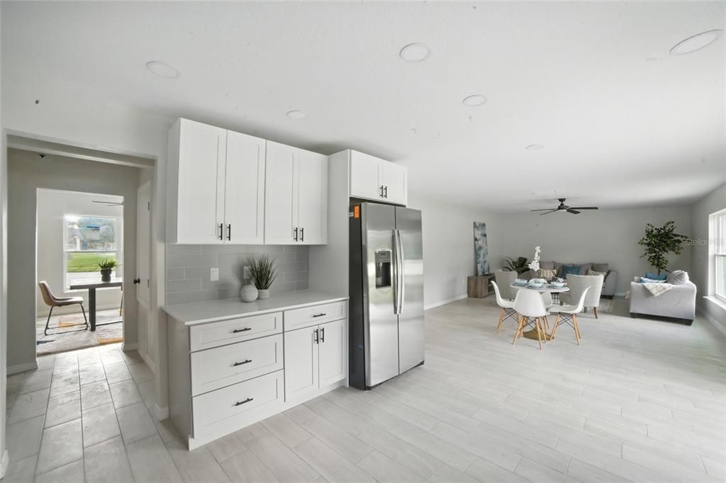 Dining room, Interior, Kitchen, Living room, Recessed Lighting, Stainless Steel Appliances, Wood Texture Flooring