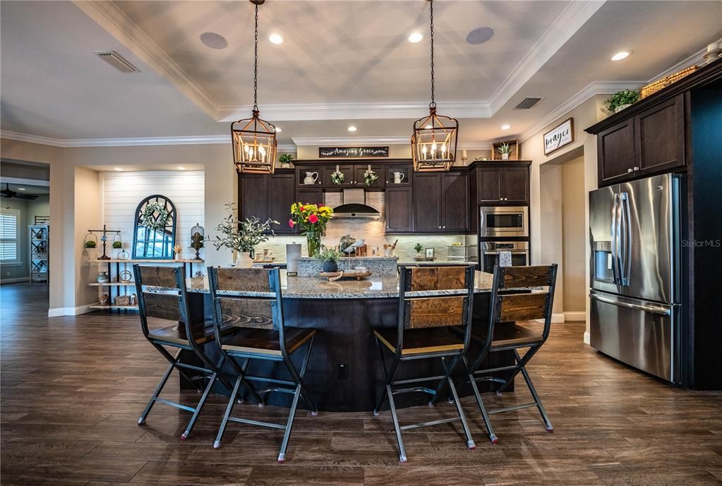 Dining room, Interior, Kitchen, Pendant Lights, Recessed Lighting, Stainless Steel Appliances, Wood Texture Flooring
