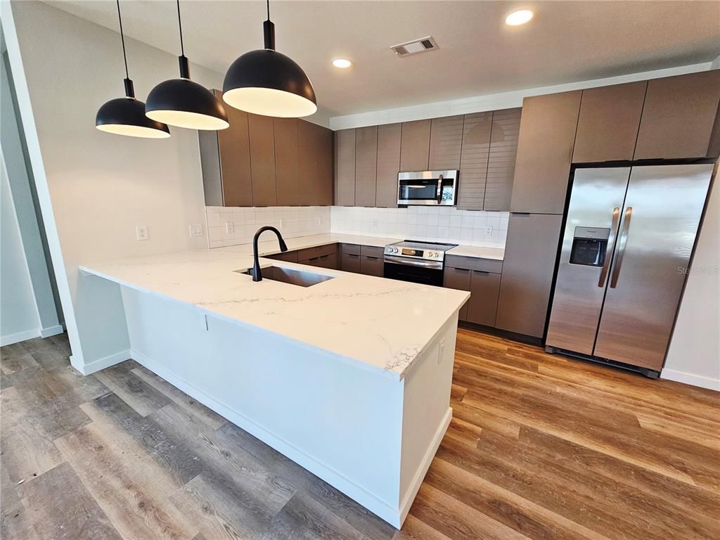 Interior, Kitchen, Pendant Lights, Recessed Lighting, Stainless Steel Appliances, Wood Texture Flooring
