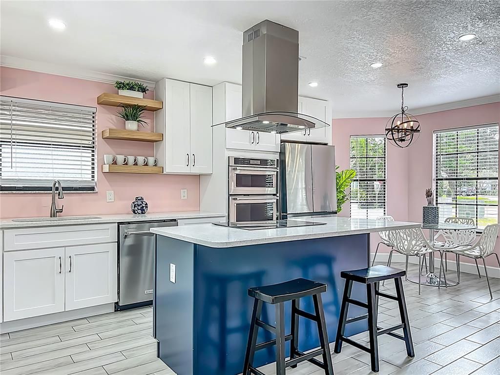 Chandelier, Dining room, Interior, Kitchen, Pendant Lights, Recessed Lighting, Stainless Steel Appliances, Wood Texture Flooring