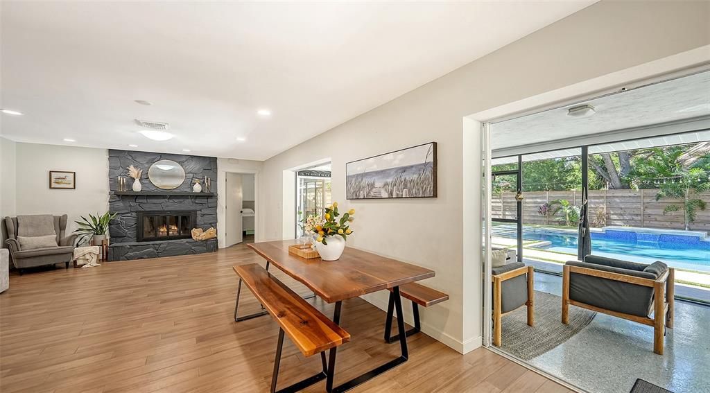 Dining room, Fireplace, Interior, Pool, Recessed Lighting, Wood Texture Flooring