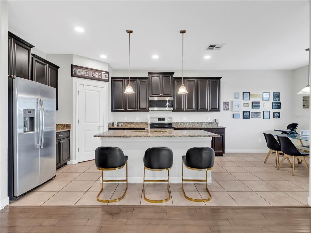 Dining room, Interior, Kitchen, Pendant Lights, Recessed Lighting, Stainless Steel Appliances, Wood Texture Flooring
