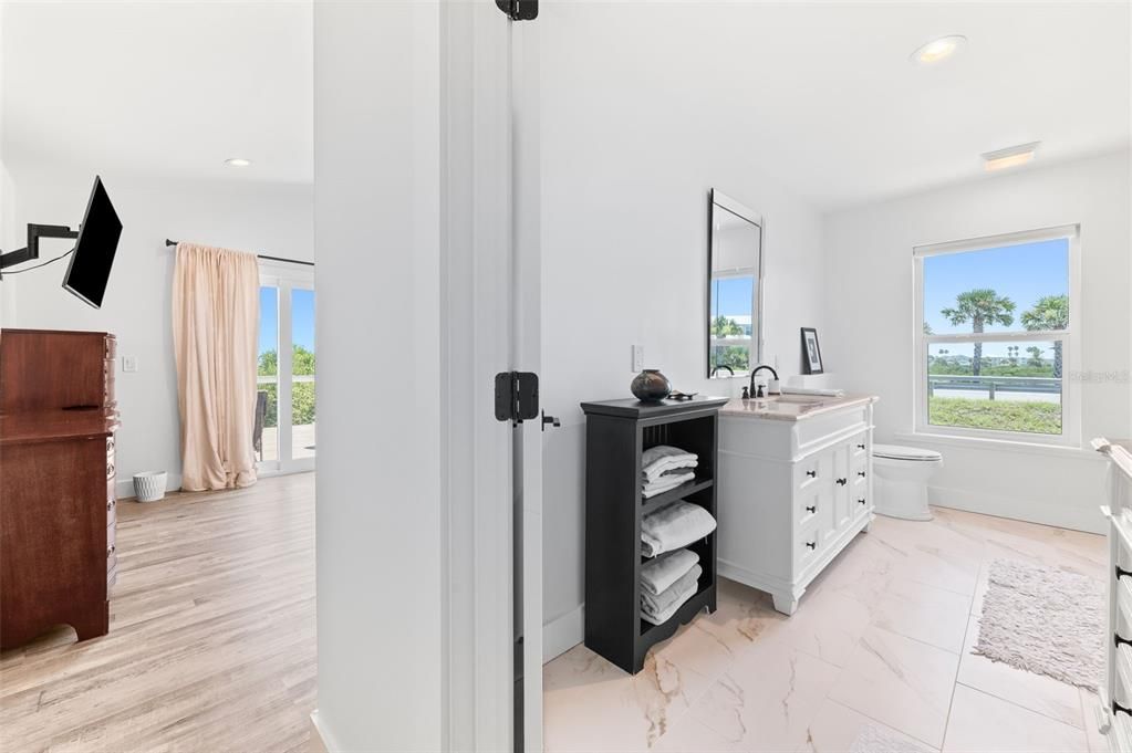 Bathroom, Dual Sink Vanities, Interior, Marble, Recessed Lighting, Wood Texture Flooring