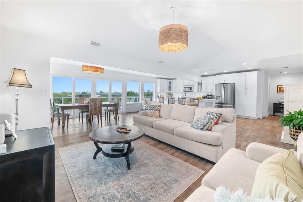 Chandelier, Dining room, Interior, Kitchen, Living room, Recessed Lighting, Stainless Steel Appliances, Wood Texture Flooring