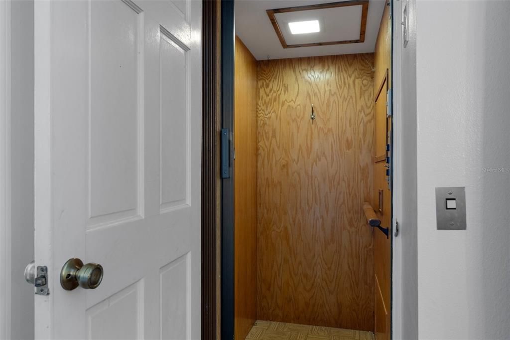 Elevator, Interior, Recessed Lighting, Wood Texture Flooring, Wooden Walls