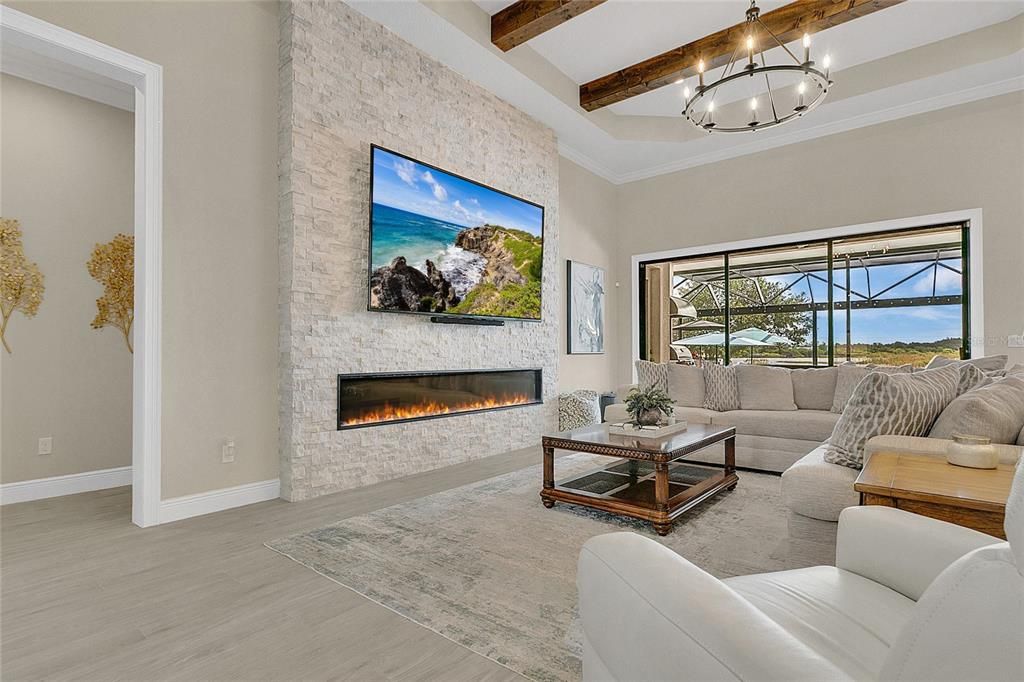 Chandelier, Fireplace, Interior, Living room, Stone Walls, Water, Wooden Beams, Wood Texture Flooring