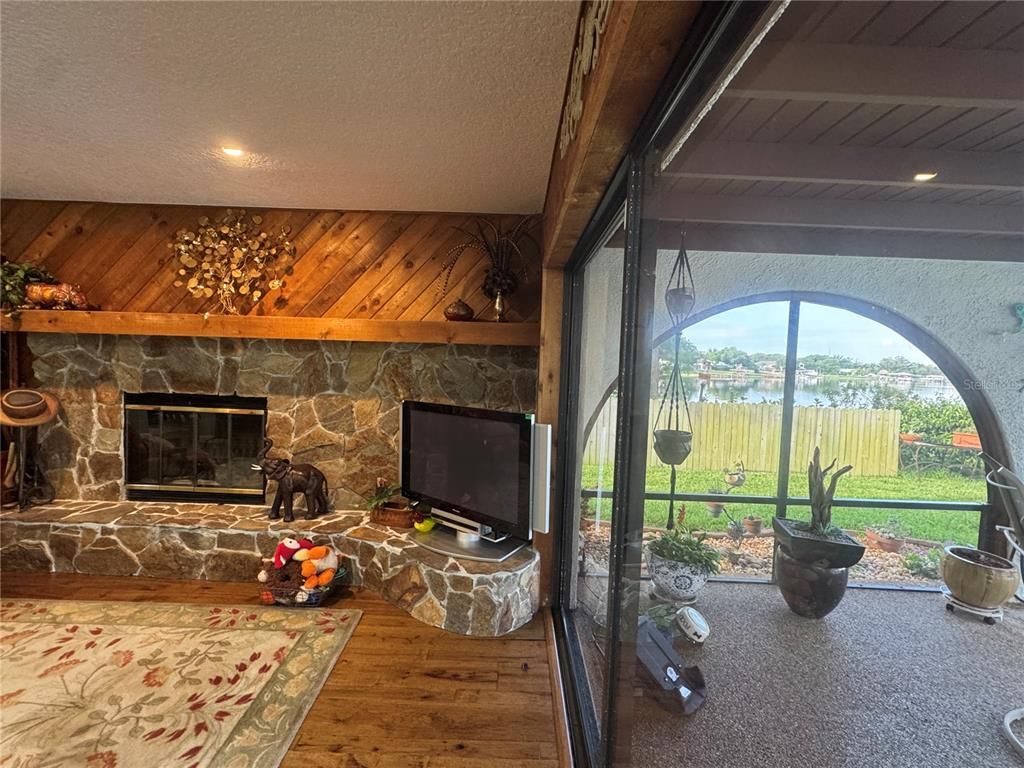 Fireplace, Interior, Recessed Lighting, Stone Walls, Wood Texture Flooring