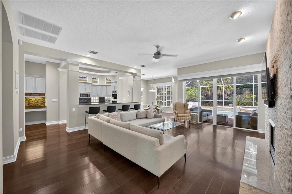 Interior, Kitchen, Living room, Pendant Lights, Recessed Lighting, Stainless Steel Appliances, Stone Walls, Wood Texture Flooring