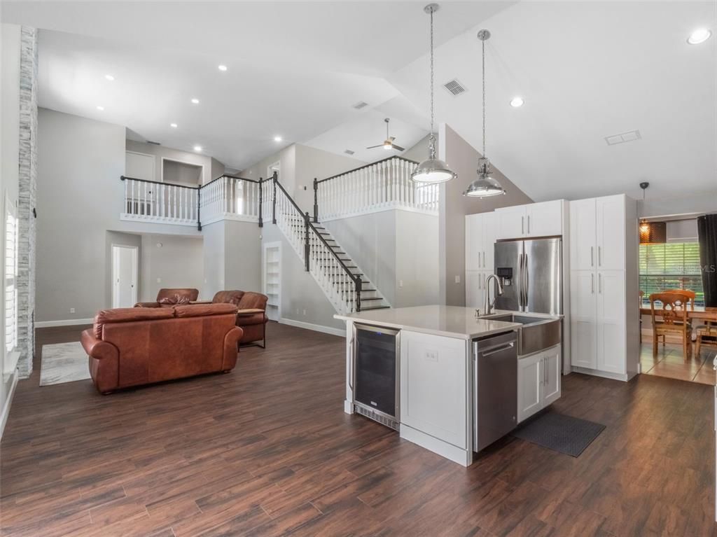 Dining room, Interior, Kitchen, Living room, Pendant Lights, Recessed Lighting, Stainless Steel Appliances, Wood Texture Flooring