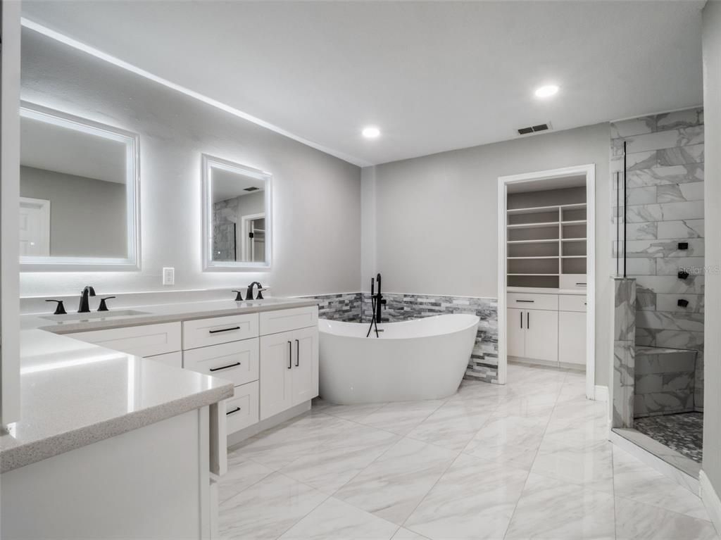Bathroom, Dual Sink Vanities, Free Standing Baths, Glass Shower, Interior, Marble, Marble Walls, Recessed Lighting
