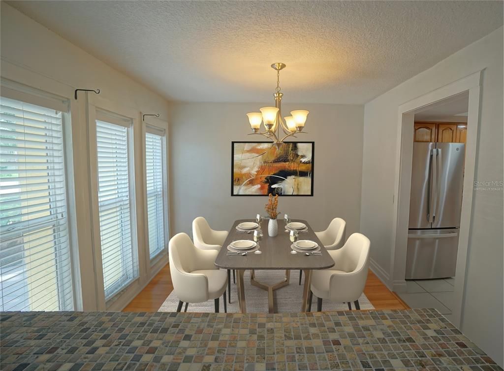 Chandelier, Dining room, Interior, Kitchen, Stainless Steel Appliances, Wood Texture Flooring