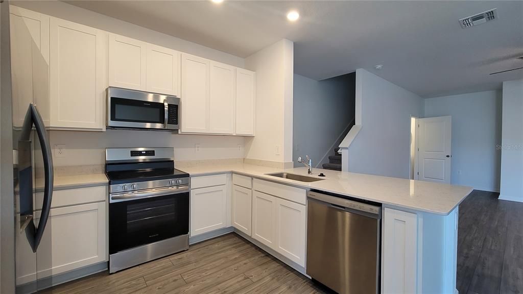 Interior, Kitchen, Recessed Lighting, Stainless Steel Appliances, Wood Texture Flooring