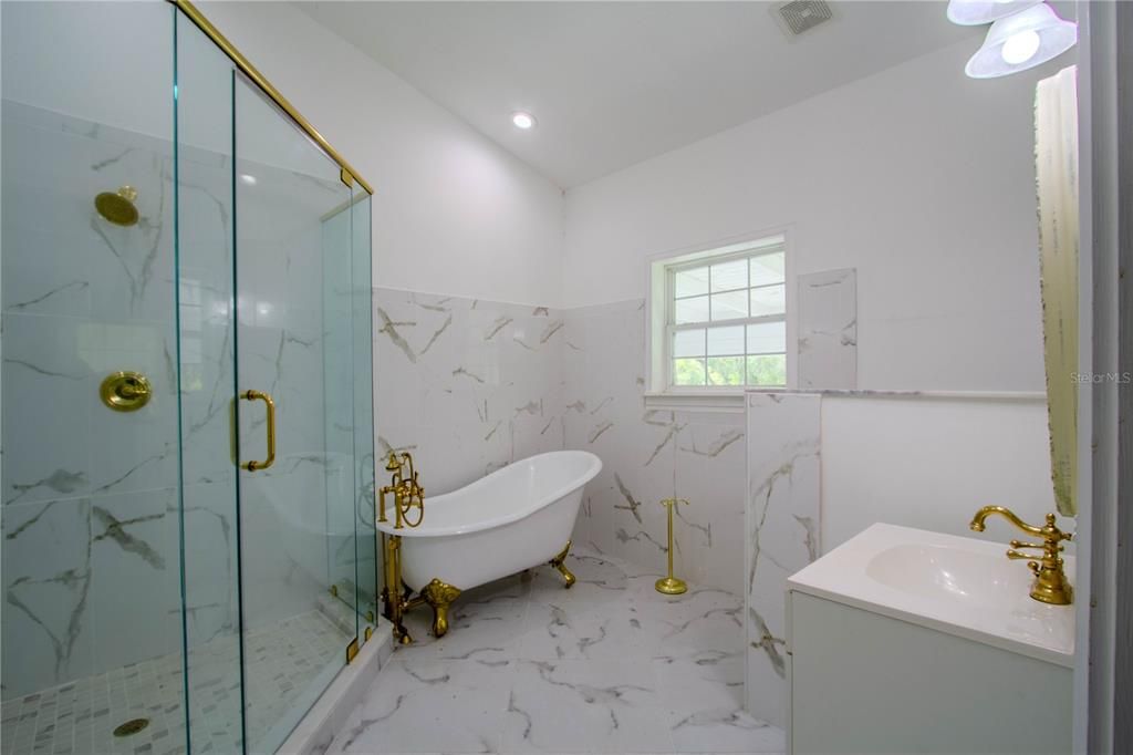 Bathroom, Free Standing Baths, Glass Shower, Interior, Marble, Marble Walls, Recessed Lighting