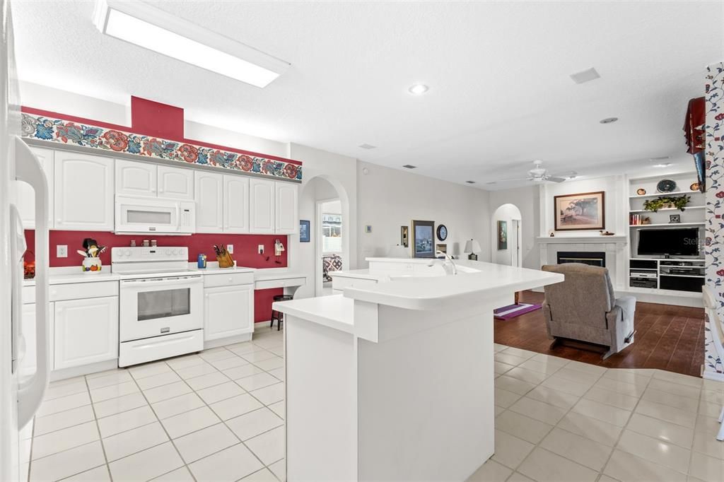 Fireplace, Interior, Kitchen, Recessed Lighting, Wood Texture Flooring